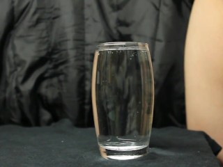 cumming in a glass of water