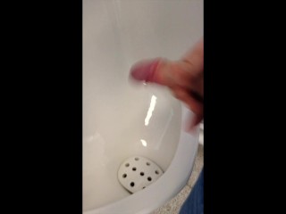 Young boy jerking and cumming in urinal