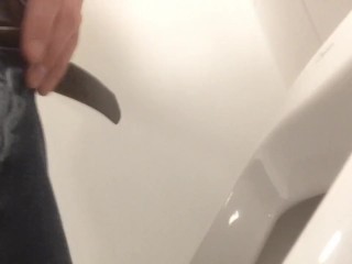 Pissing in urinal