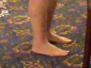 Candid pantyhose feet at a function.