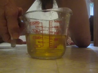 Pissing in a measuring cup!