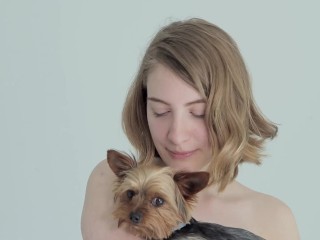 Hot naked blonde cuddling her puppy