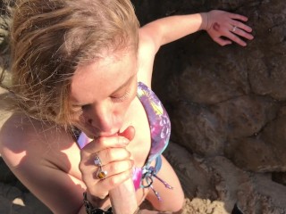 Model blows on the beach