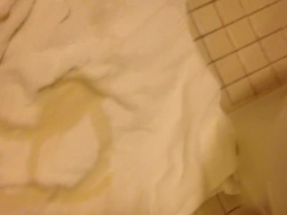 Pissing circles on a towel