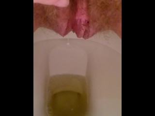 Close up hairy pussy piss and rub on toilet