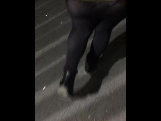 Black tights with Floral panties walking in public park