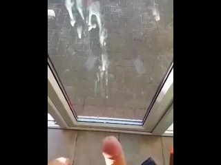 Shooting a huge load against the window