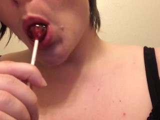 Masturbating while sucking on a sucker