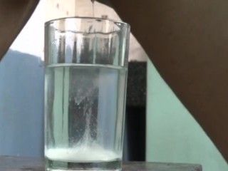 Dude cumming in a glass of water