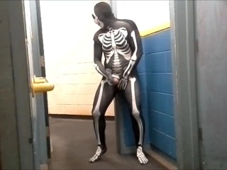 skeleton with hard on jerks off in gym hall