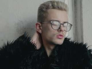 Blond twink boy nude in fur coat shows his long uncut cock