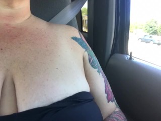 Chastity takes a Sunday drive topless