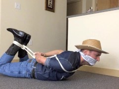 Hogtied Gagged Cowboy in Tight Wranglers