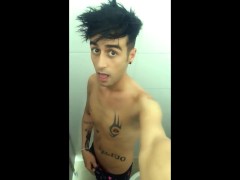 Tattooed twink is pissing in waterpark piss filled toilet