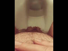 Close-up hairy pussy pissing  on public toilet after holding 