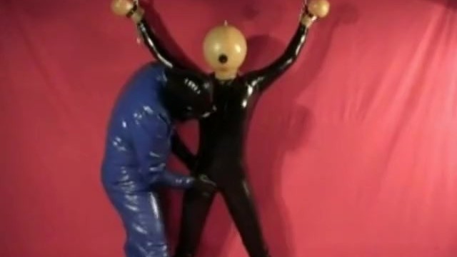 Latex Catsuit Slave Girl With Rubber Ballhood In Bondage Gasmask