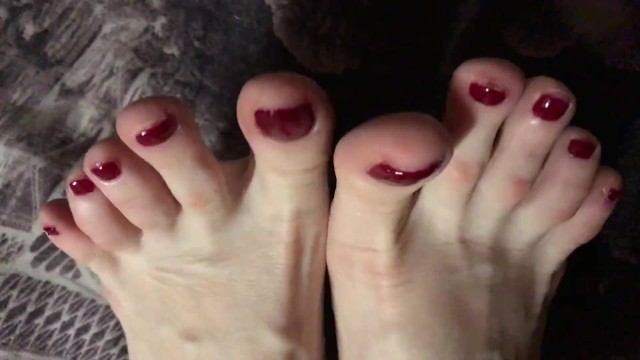 Painted naked girls Red painted toenails close up