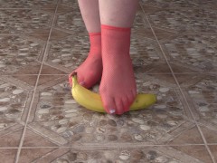 Fat legs in socks ruthlessly trample banana. Crush Fetish