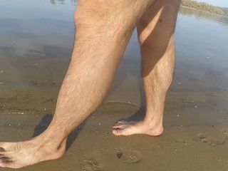 Walking naked on the beach