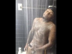 Tattooed  stud jerks dick in the shower 